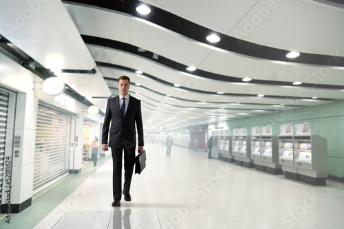 Wallpaper Mural business man walking in subway Torontodigital.ca