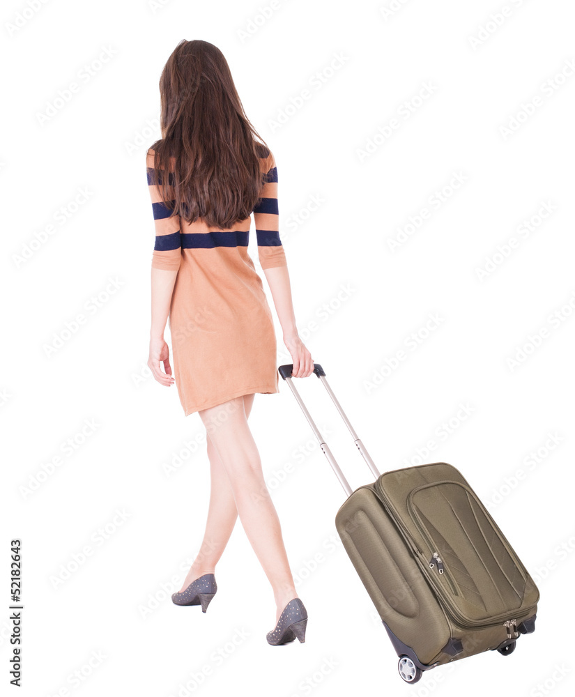 back view of walking woman with green suitcase. back view of walking woman with green suitcase.