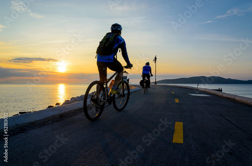 Bicycle ride with morning sun rise