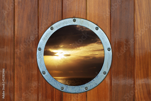 Boat porthole with ocean view