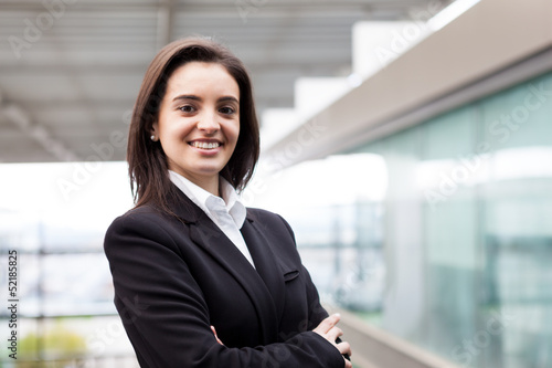 Closeup portrait of cute young business woman smiling at the off