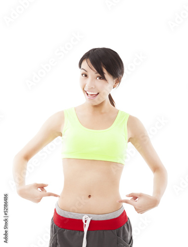 happy young woman doing  exercise and point his waist © Tom Wang