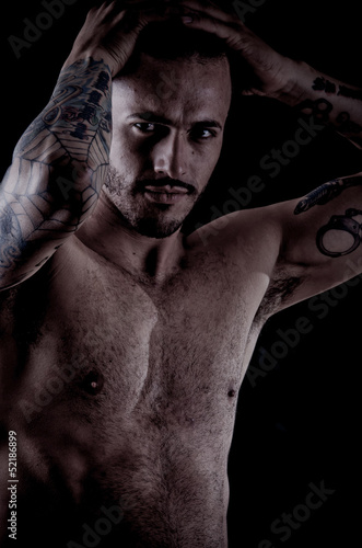 Konstfotografi Muscular young man with many tattoos, dragan style