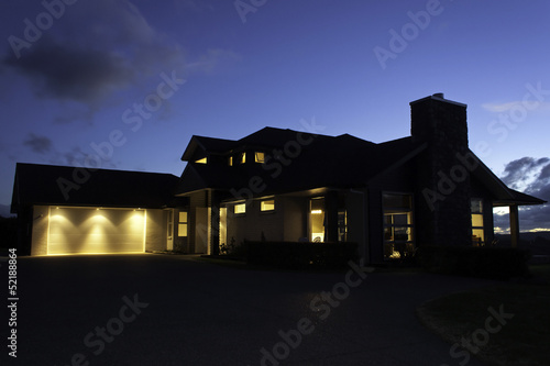 Modern house exterior with lighting at night