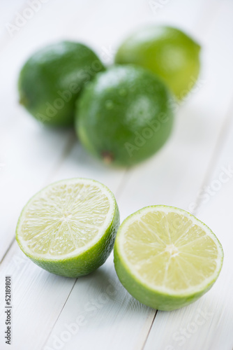 Fruits: fresh ripe limes on wooden boards
