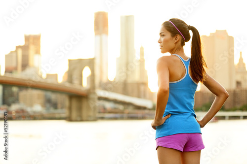Fitness woman runner relaxing after city running
