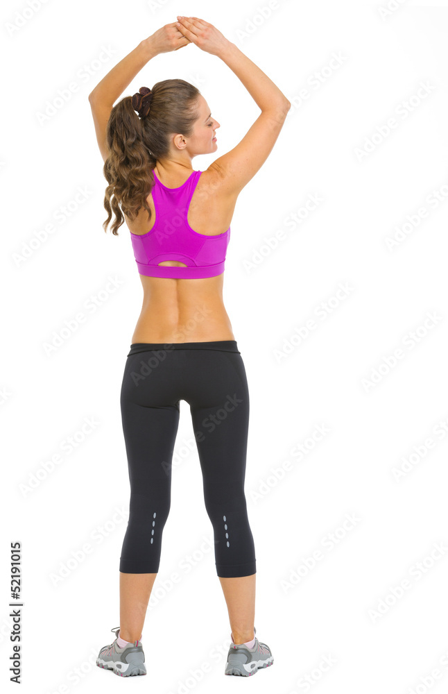 Full length portrait of fitness young woman . rear view Full length portrait of fitness young woman . rear view