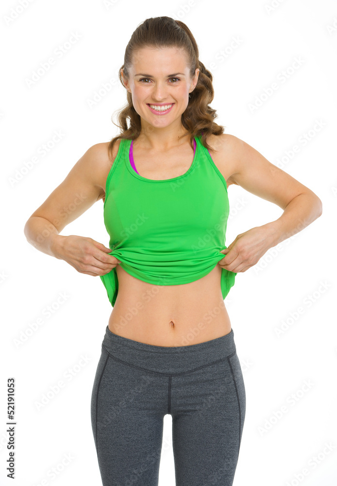 Happy fitness young woman showing flat belly Happy fitness young woman showing flat belly