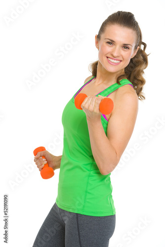 Happy fitness young woman with dumbbells