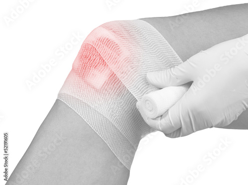 Cotton bandage over a wound on knee.