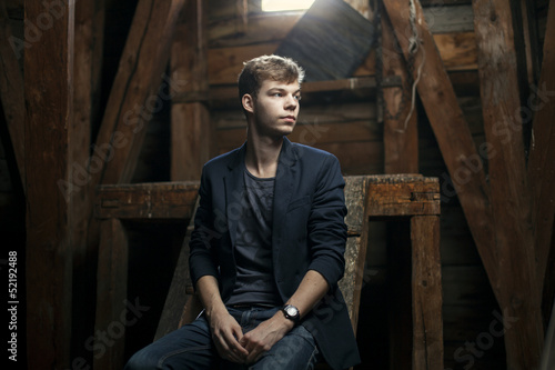 young blond teenager in church attic