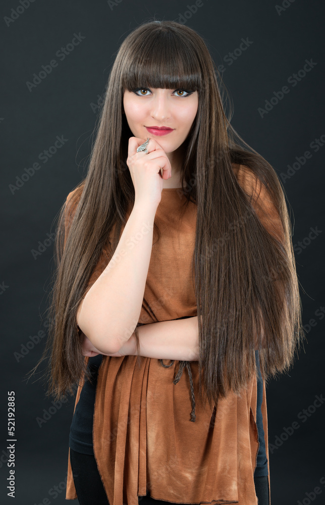studio portrait of attractive young woman with long hair Stock Photo ...