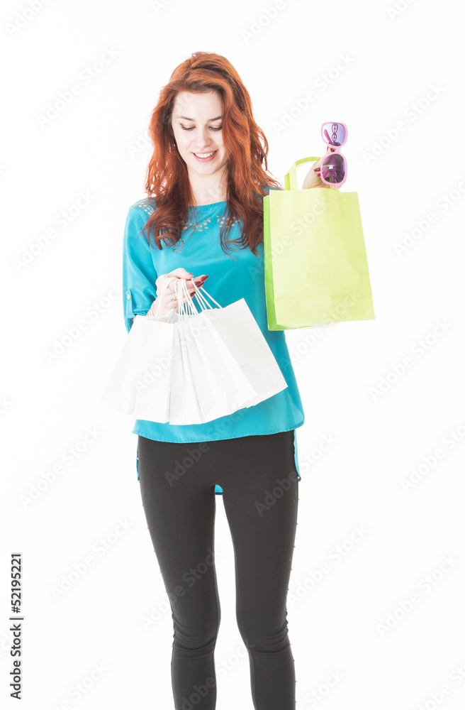 Pretty red hair woman holding shopping bags Pretty red hair woman holding shopping bags