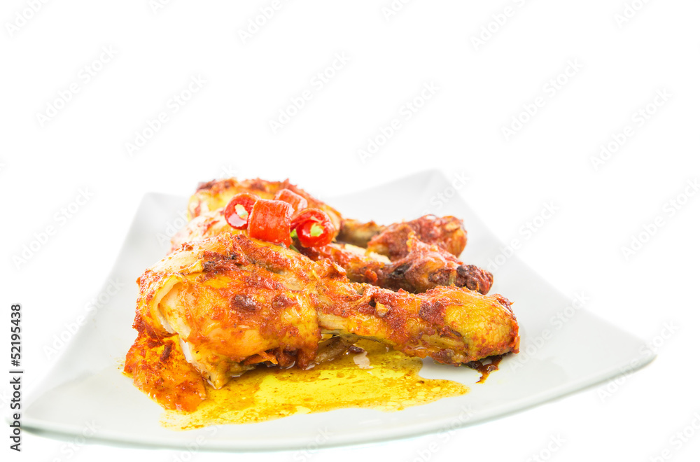 Tandoori chicken in a plate over white background Tandoori chicken in a plate over white background