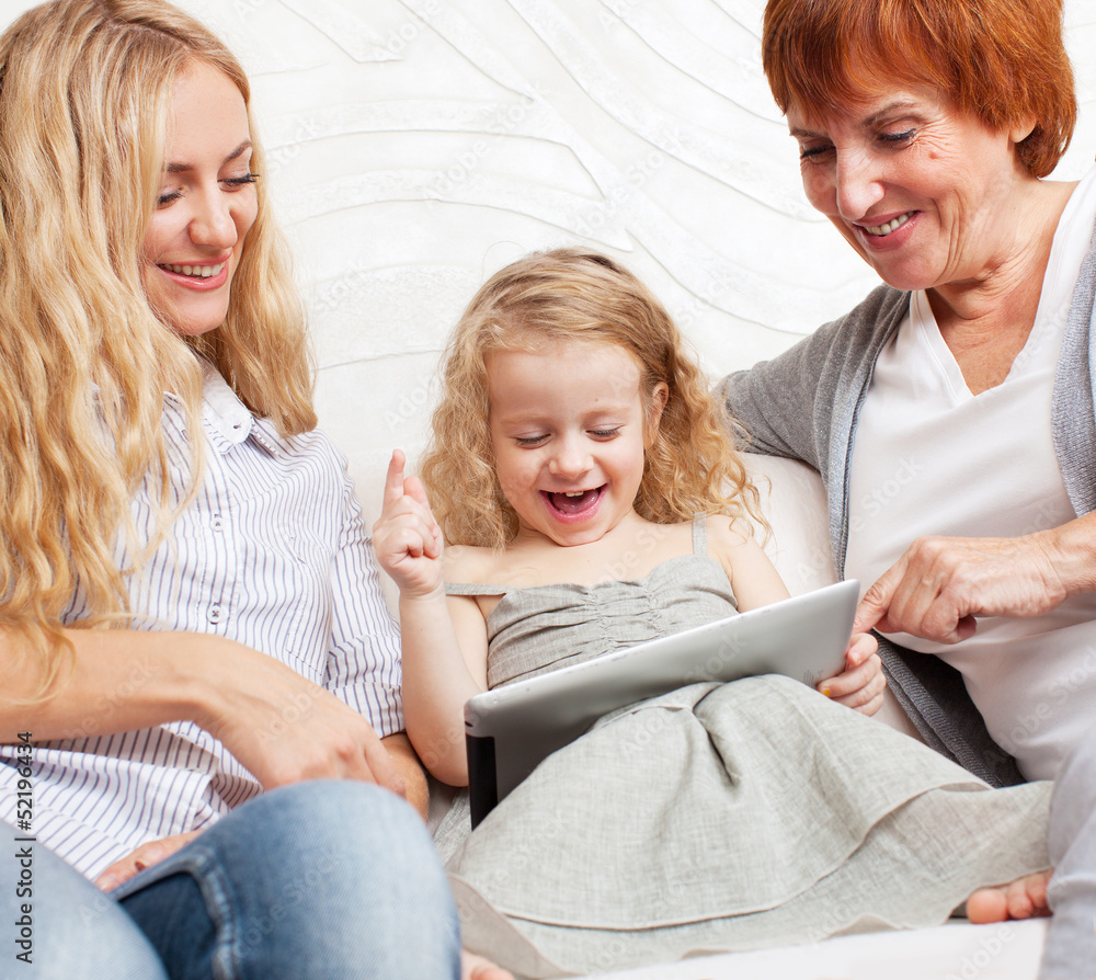 Family wiht tablet computer at sofa Family wiht tablet computer at sofa