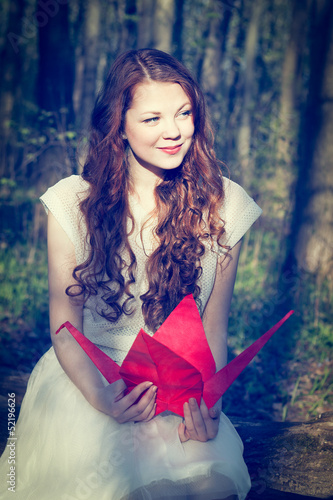 Girl with origami crane
