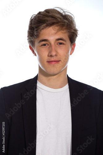 Young smiling business man with blue jacket isolated on white.