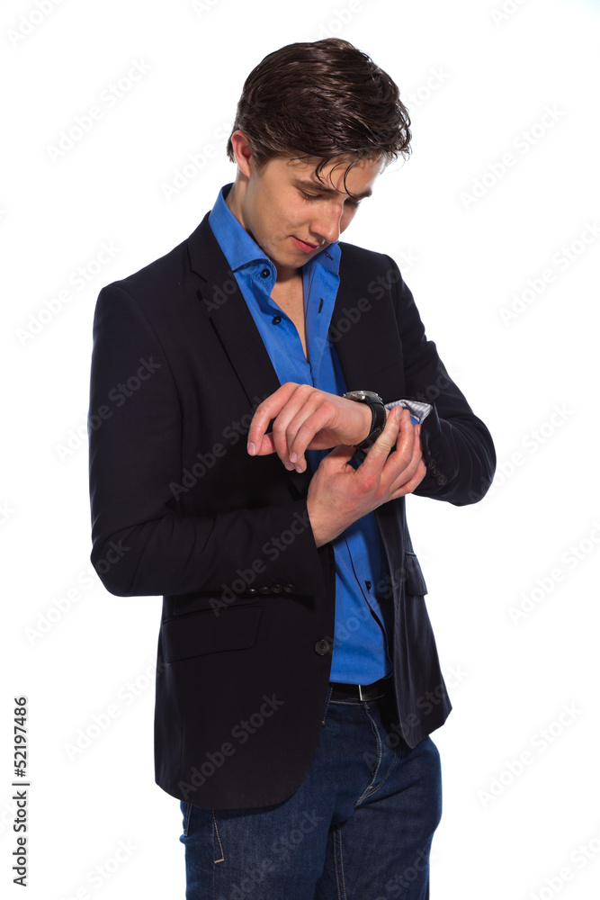 Young business man wearing blue shirt and jacket looking on his Young business man wearing blue shirt and jacket looking on his