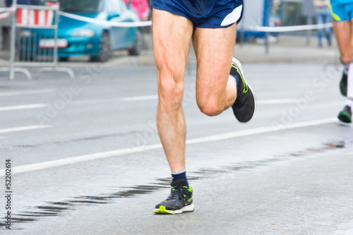 People running in city marathon