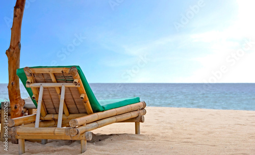 Relaxing Chair on white sandy Beach