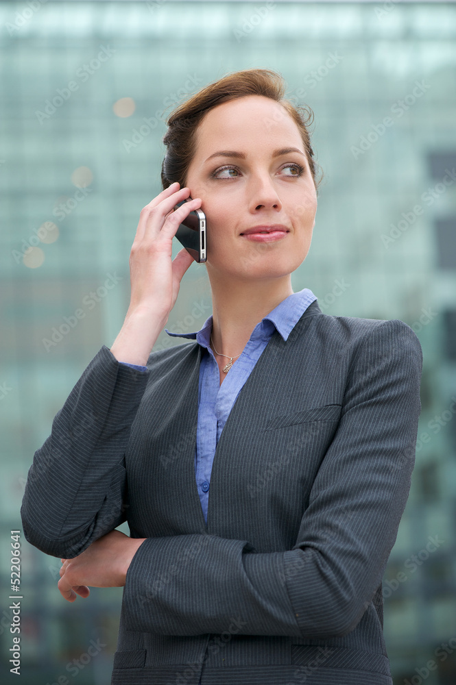 portrait of a confident young business woman talking on phone portrait of a confident young business woman talking on phone