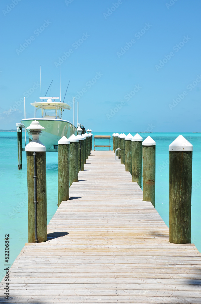 Yacht at the wooden jetty. Exuma, Bahamas