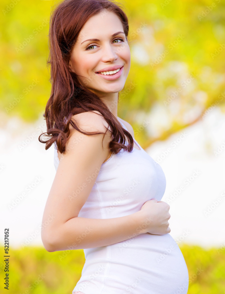 Pregnant female in summer park Pregnant female in summer park