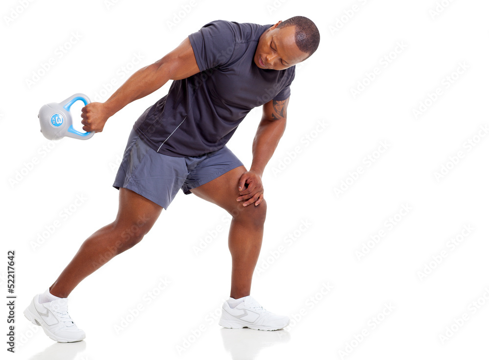 african man exercising with kettle bell