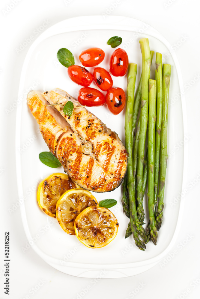 Grilled salmon steak with asparagus and cherry tomatoes Grilled salmon steak with asparagus and cherry tomatoes