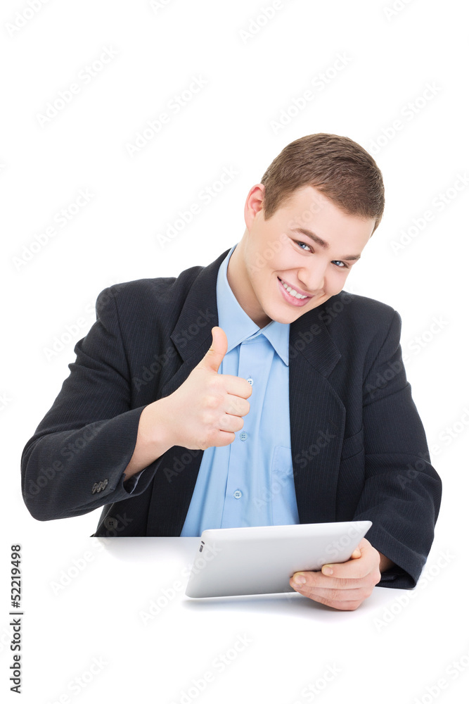 Smiling businessman with tablet computer showing thumb up Smiling businessman with tablet computer showing thumb up