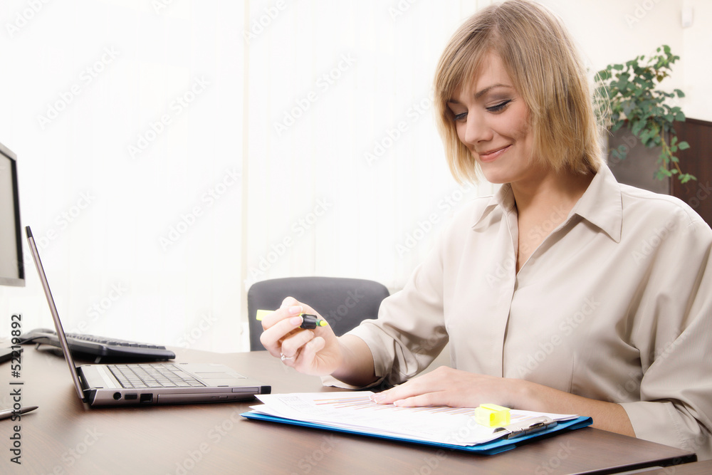 Businesswoman highlighting chart Businesswoman highlighting chart