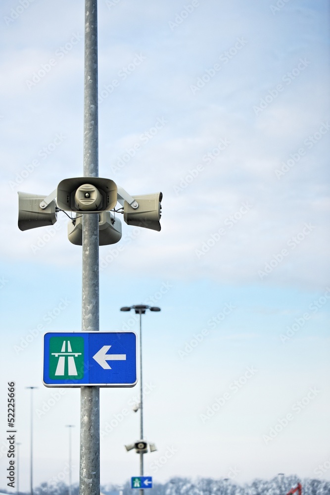 Loudspeaker on pole with hihgway sign Loudspeaker on pole with hihgway sign