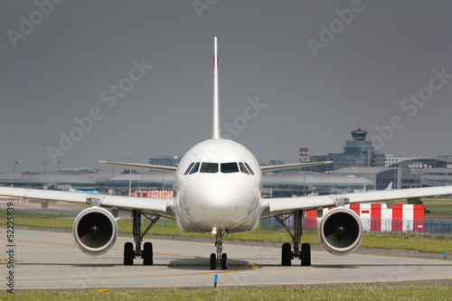 Taxiing white plane