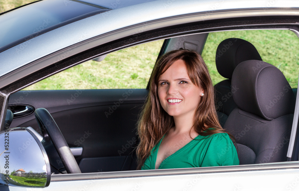 Pretty young woman in her car Pretty young woman in her car