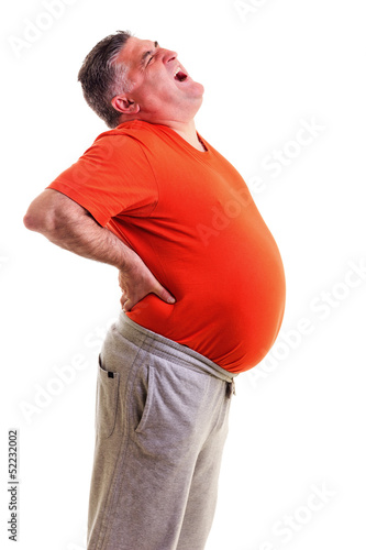 Obraz na płótnie Overweight man with acute back ache bending over backwards to at w salonie