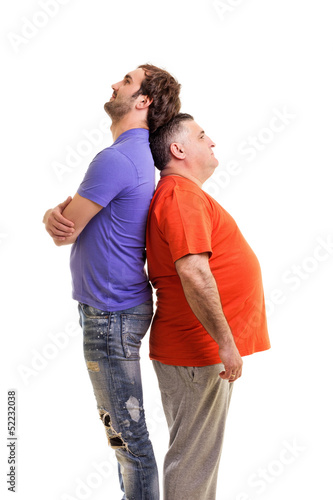 Two men standing back to back