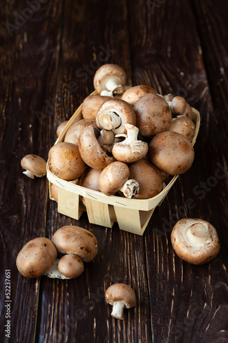 Fresh whole button mushrooms in a basket