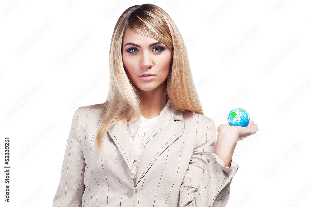 Pretty smiling woman holding a world globe. Business woman