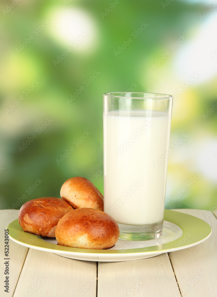 Bread rolls and glass of milk