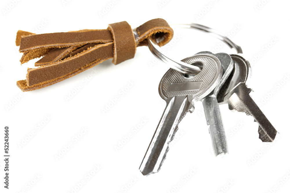 Key with leather trinket isolated on white Key with leather trinket isolated on white