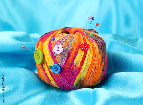 Colorful buttons and multicolor wool ball © Africa Studio