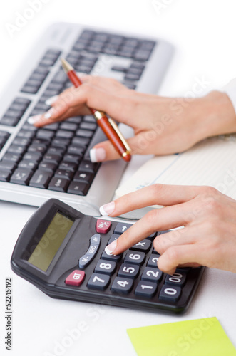 Hands working on the calculator