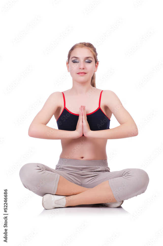 Young female doing exercises on white