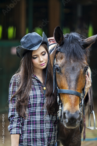 Attractive girl with horse