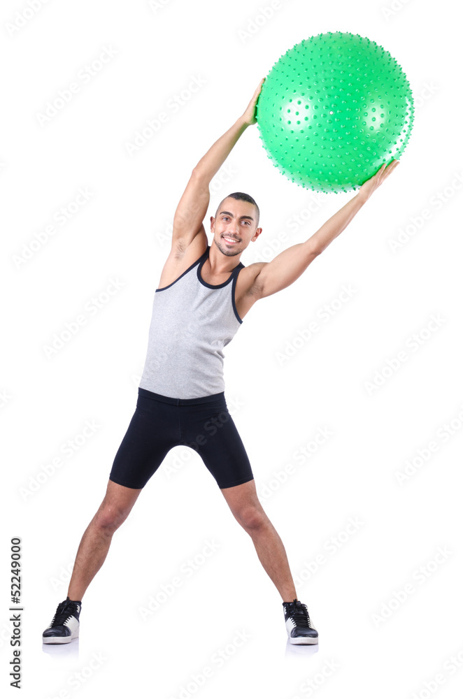 Man with swiss ball doing exercises on white