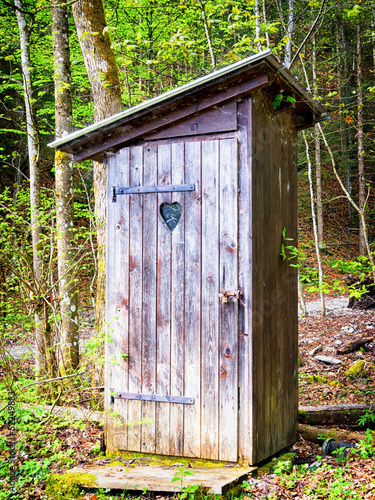 old wooden outhouse photo