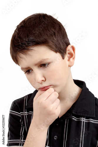 pensive young boy isolated on white background