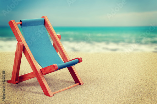Fotografia, Obraz Sun lounger in sandy beach vintage toned