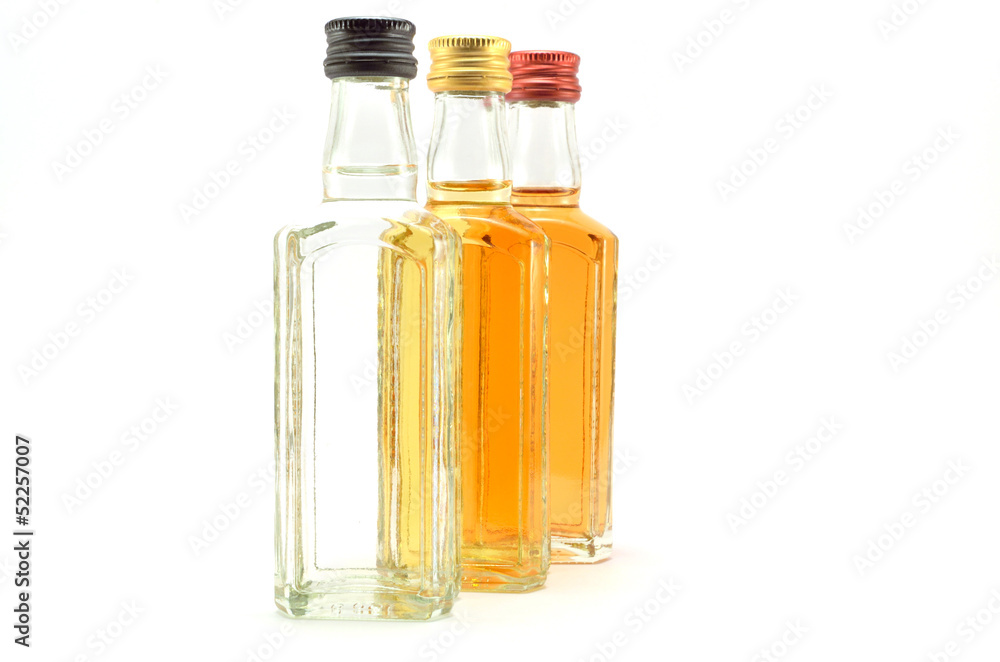 glass bottles filled with liquids of different colors glass bottles filled with liquids of different colors