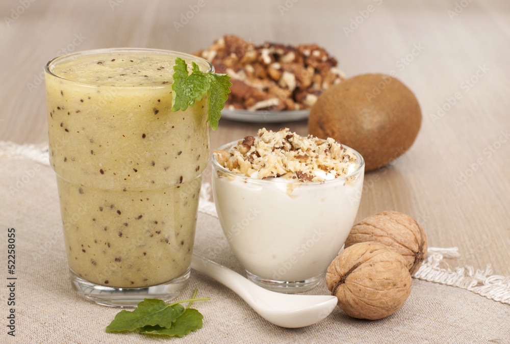 Fitness breakfast with yogurt, smoothies out of kiwi fruit and w Fitness breakfast with yogurt, smoothies out of kiwi fruit and w